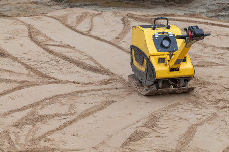 Vibratory plate compactor under construction 