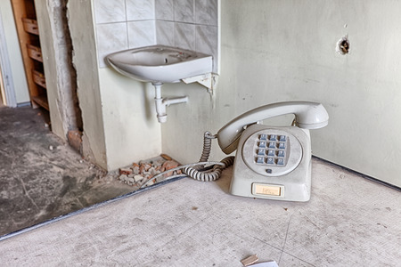 Old phone in a forgotten medical officeの写真素材