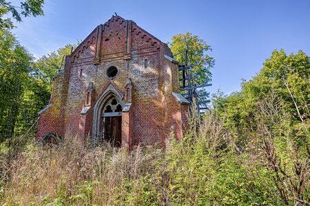 Ruined and forgotten chapel with red bricksの写真素材