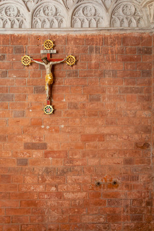 Cross on the wall of the Gothic cathedralの写真素材