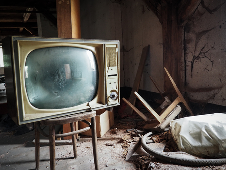 Old television set on an abandoned atticの写真素材