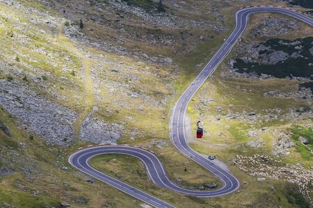 Mountain road crossing the southern section of the Carpathian Mountains of Romaniaの写真素材