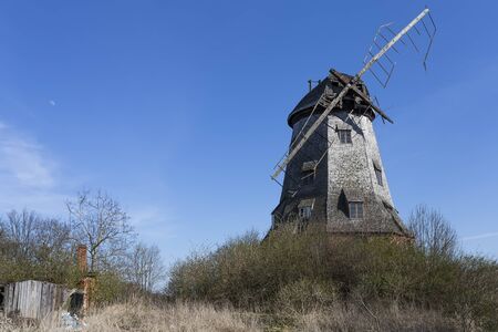 Old abandoned windmill with broken sailsの写真素材