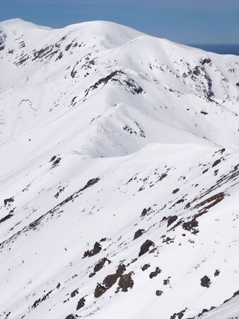 Snow in the  high mountainsの写真素材