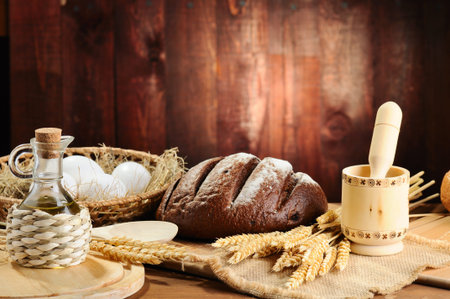 sliced bread and wheat on the wooden table