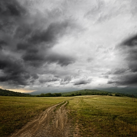 dirt road at the summer dramatic dayの写真素材