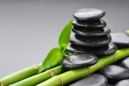 zen basalt stones and bamboo on the blackの写真素材