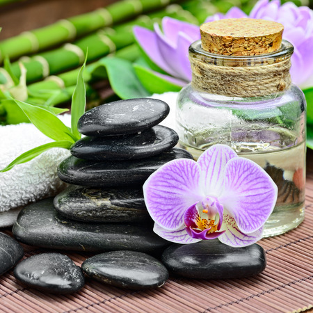 zen basalt stones and orchid on the woodの写真素材