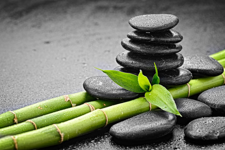 zen basalt stones and bamboo on the blackの写真素材