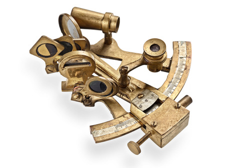 old bronze sextant on the white backgroundの写真素材