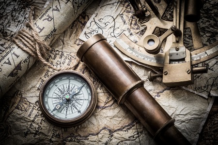 vintage  still life with compass,sextant spyglass and old mapの写真素材