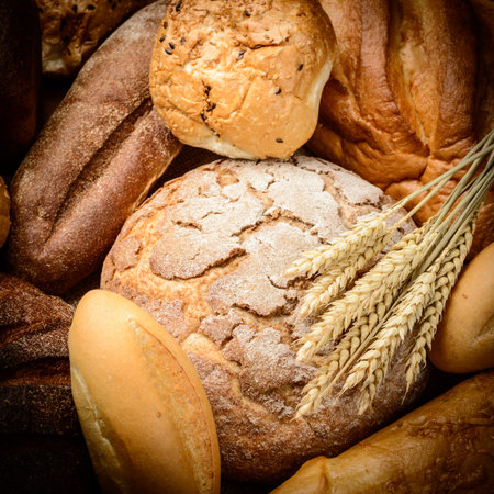 fresh bread  and wheat on the wooden