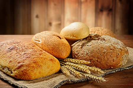 fresh bread  and wheat on the wooden