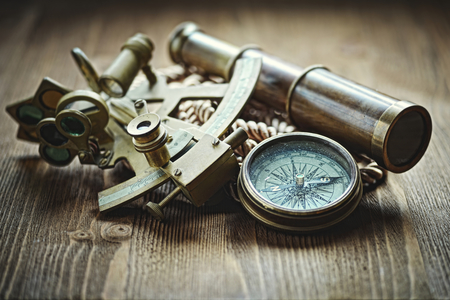 vintage  still life with compass,sextant and spyglassの写真素材