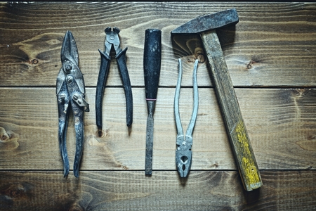 old tools on wooden backgroundの写真素材