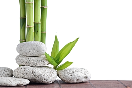 zen basalt stones and bamboo isolated on whiteの写真素材