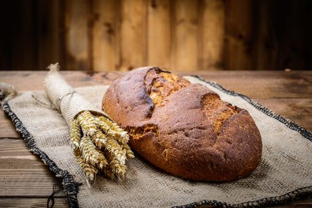 fresh bread  and wheat on the wooden