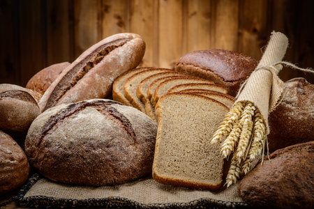fresh bread  and wheat on the wooden