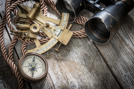 vintage still life with compass,sextant and spyglassの写真素材