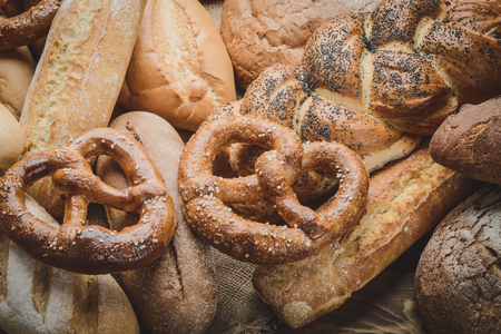 fresh bread and wheat on the woodenの写真素材