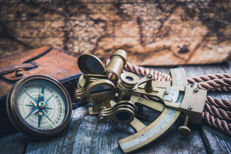 vintage still life with compass,sextant and spyglass
