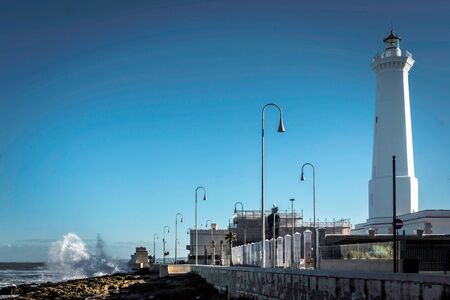 Lighthouse agains blue sky in daylightの写真素材