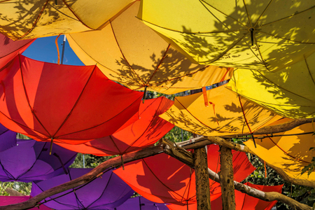 Upturned bright and colorful umbrellasの写真素材