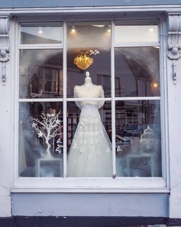 Wedding dress displayed in a shop windowの写真素材