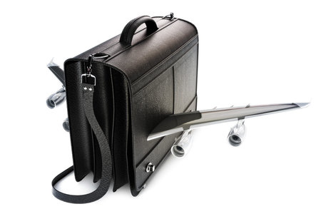 Traveling business black leather suitcase with wings,airline travel concept on a white background 