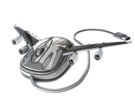 Book a flight online , Computer mouse with aircraft wings,airline online travel concept on a white background の写真素材