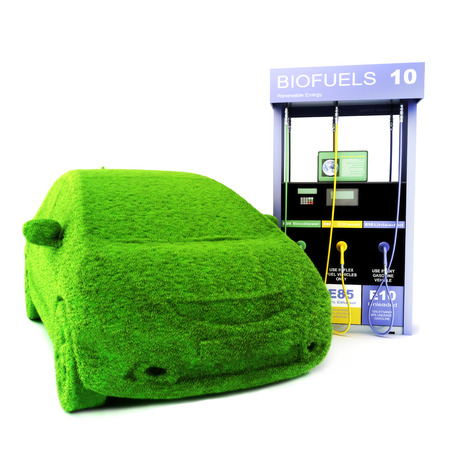 Alternative power concept eco car  Grass covered car next to a Bio fuels pump on a white background  Renewable energy の写真素材