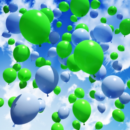Blue and green Balloon s released into the skyの写真素材