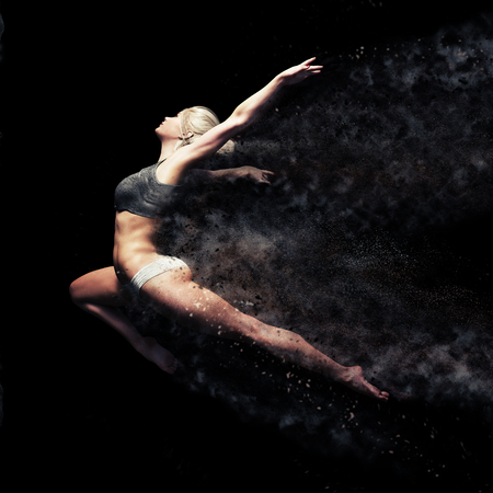 Athletic female leaping into the air with a black background. Symbolism of strength , power and beauty  . 3d rendering with dispersion effect.の写真素材