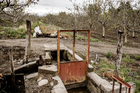 The mechanism the local farms use to channel water from the local supply into their farm.  They get a few hours of water per weekの写真素材