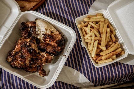 My dinner after a long day. $6.50 for an entire chicken and order of fries!の写真素材