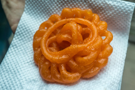 Jalebi - deep-frying wheat flour that is then soaked in sugary syrum