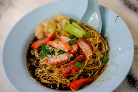 A nooldles on the plate in the Street Food Market