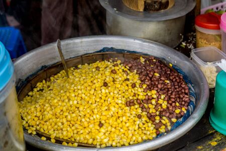 Street food in Yangon, Myanmar - Beans, corn, pepper chutney, lime, salt, and other greensの写真素材