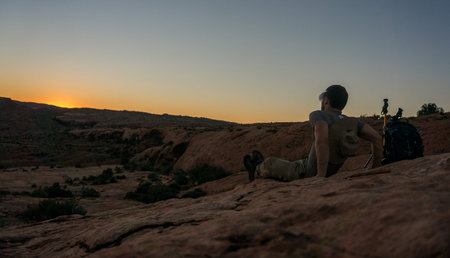 Man watching sunset in desert