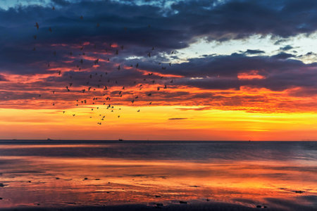 Colorful skies with clouds in the sky on the beach during sunset in Southern Thailand
