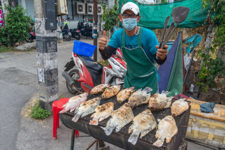 Salted and stuffed fish for sale in Northern Thailand on a grill in iopen marketのeditorial素材