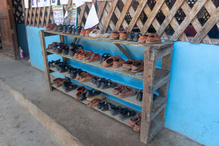 Shoes of the school children outside while they are inside learningのeditorial素材