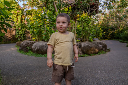 Portrait of a cute little boy in the park. Selective focus.の写真素材