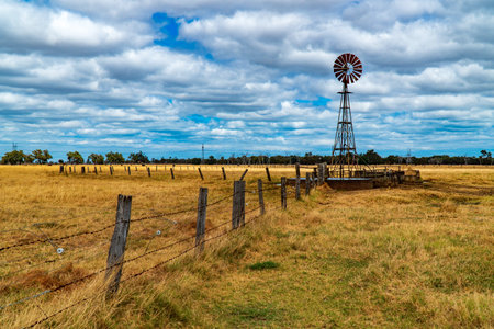 Windmill on a field in rural Western Australia.の写真素材