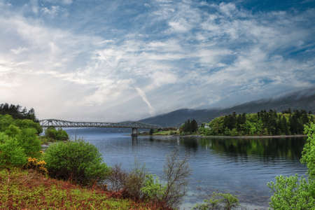 Ballachulish Bridge, Still River, Blue Skies.の写真素材