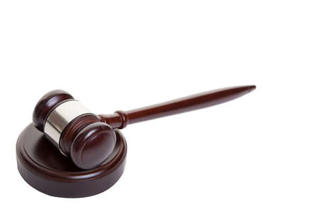 Shot of wooden gavel lying on side on block の写真素材