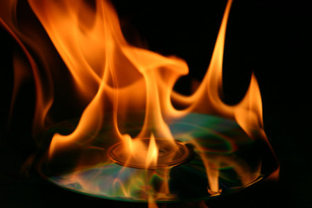 Burning of a CD - layingの写真素材