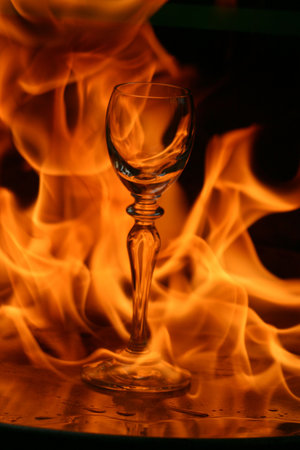 Glass surrounded by flamesの写真素材