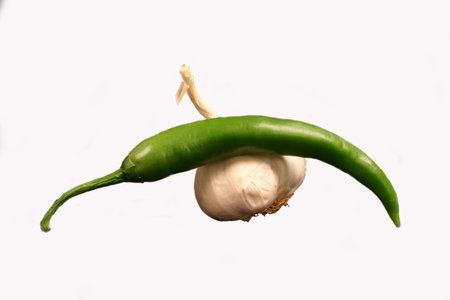 Green chili pepper with garlic, isolatedの写真素材