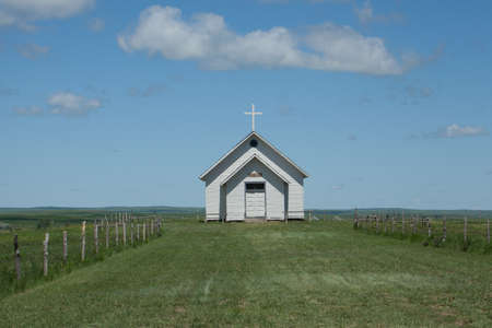 A old white church on the American plains.の写真素材